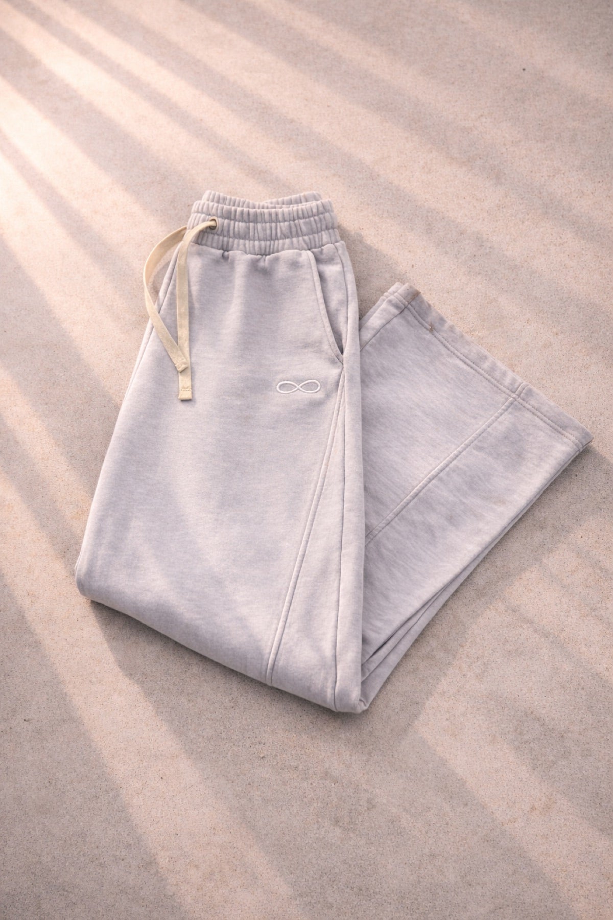 Loose Stitches Infinite Sweatpants in light gray, folded flat lay